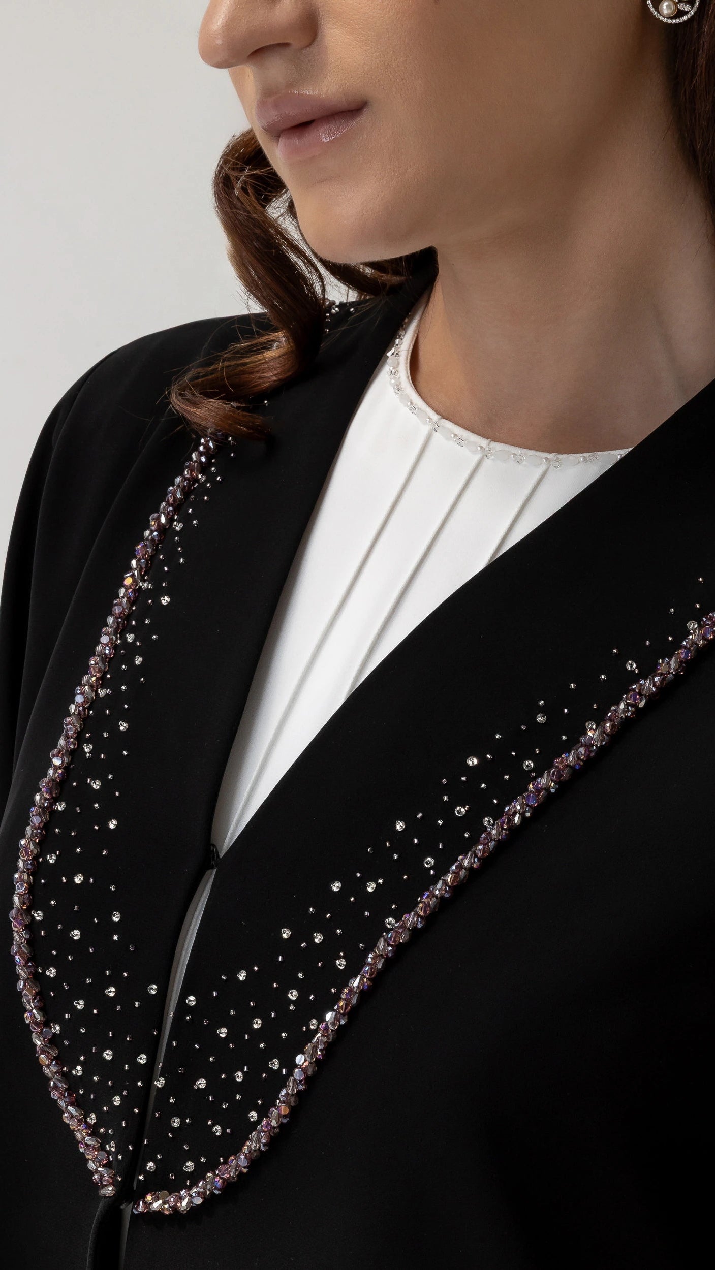 Nuhaylah Noir Eclat Abaya Crystal embellished neckline close-up on black luxury abaya