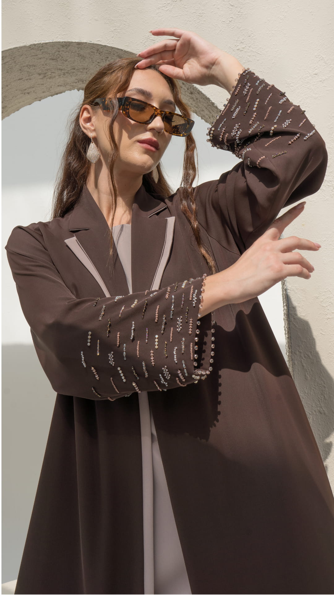 RANYA | Cocoa Crystal Rain Close-up of brown abaya sleeve with linear crystal beadwork rain pattern