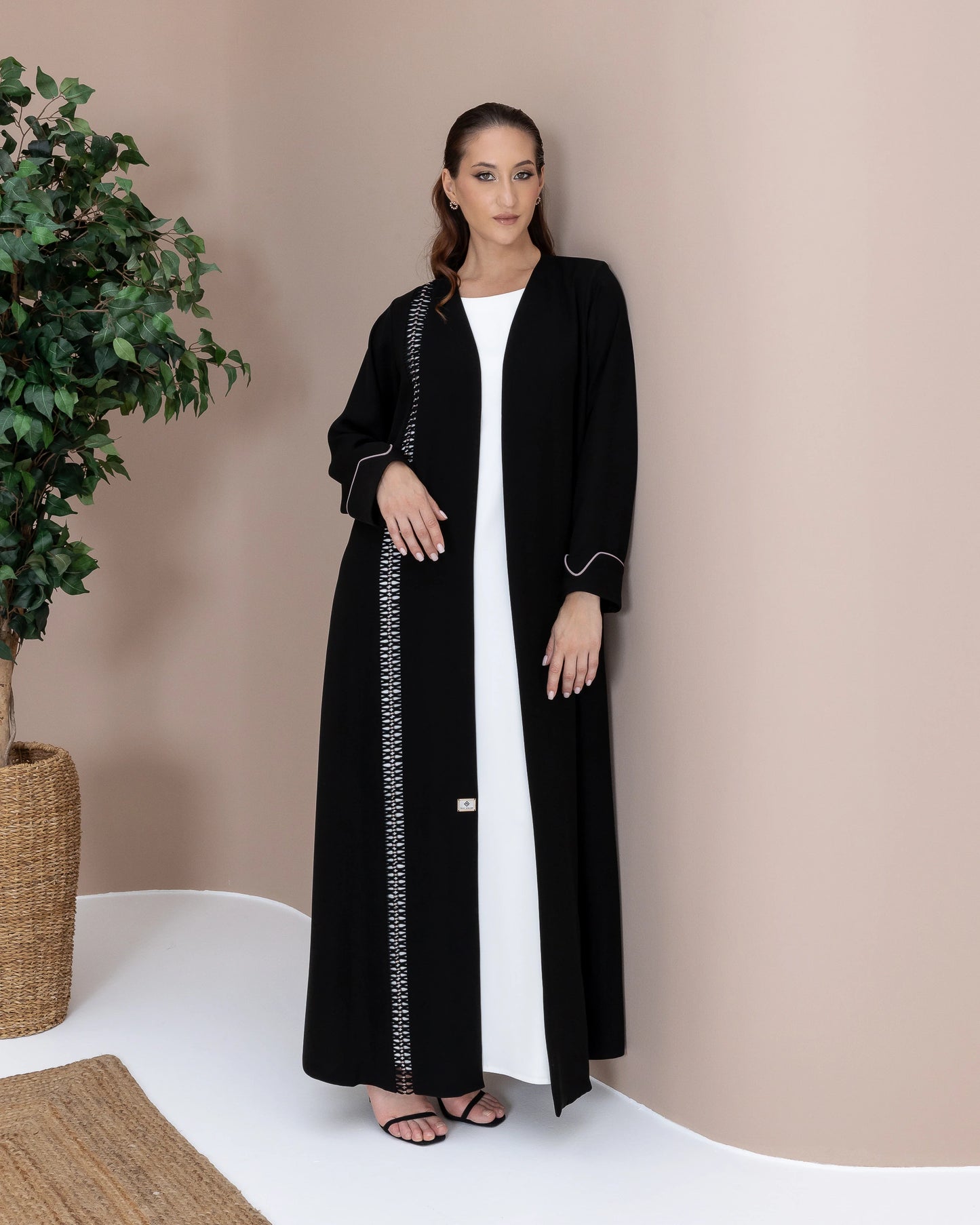 RASMAH Eclipse Noir modern monochrome abaya side portrait with woven detailing