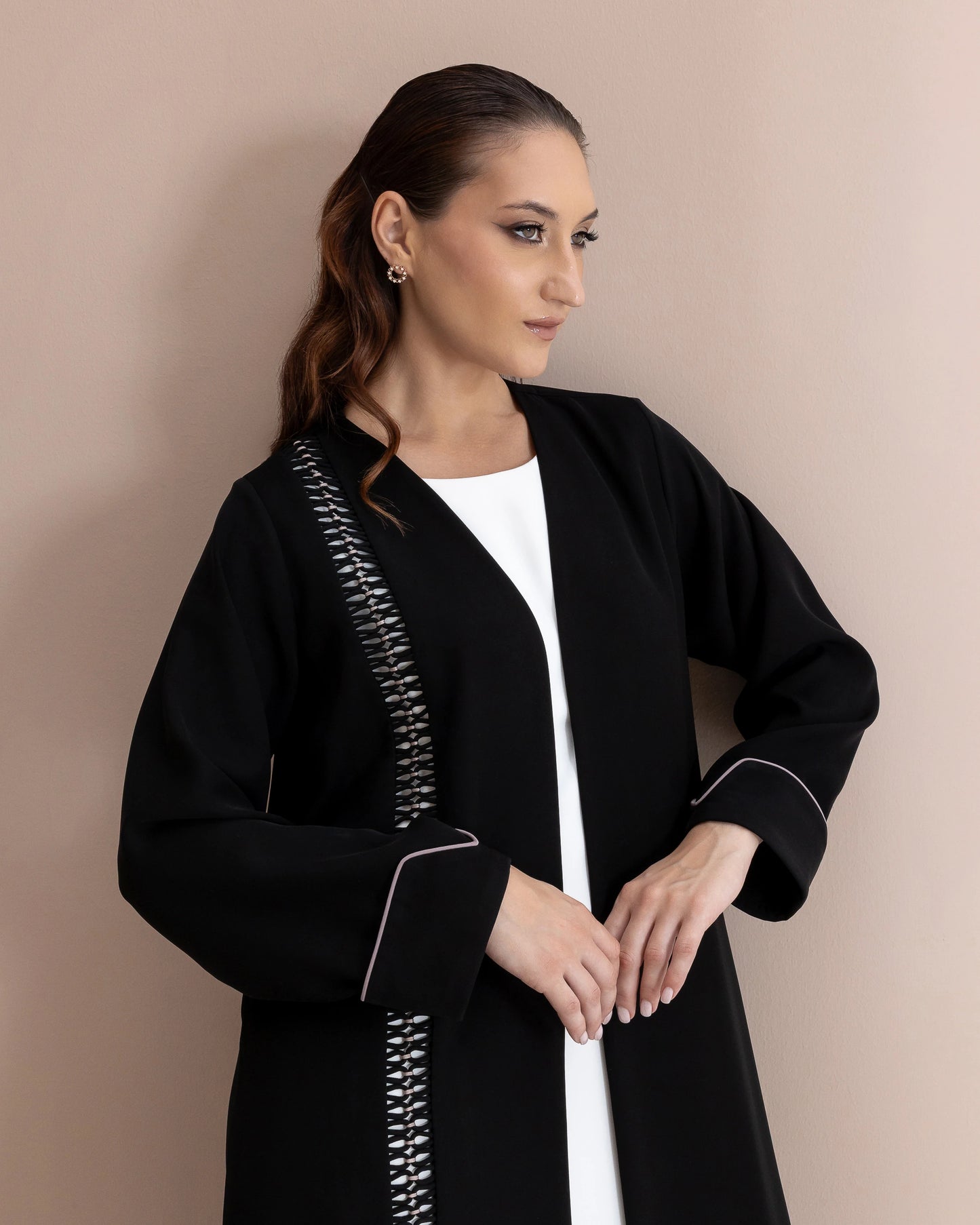 RASMAH Eclipse Noir luxury black abaya with woven monochrome detailing close-up portrait
