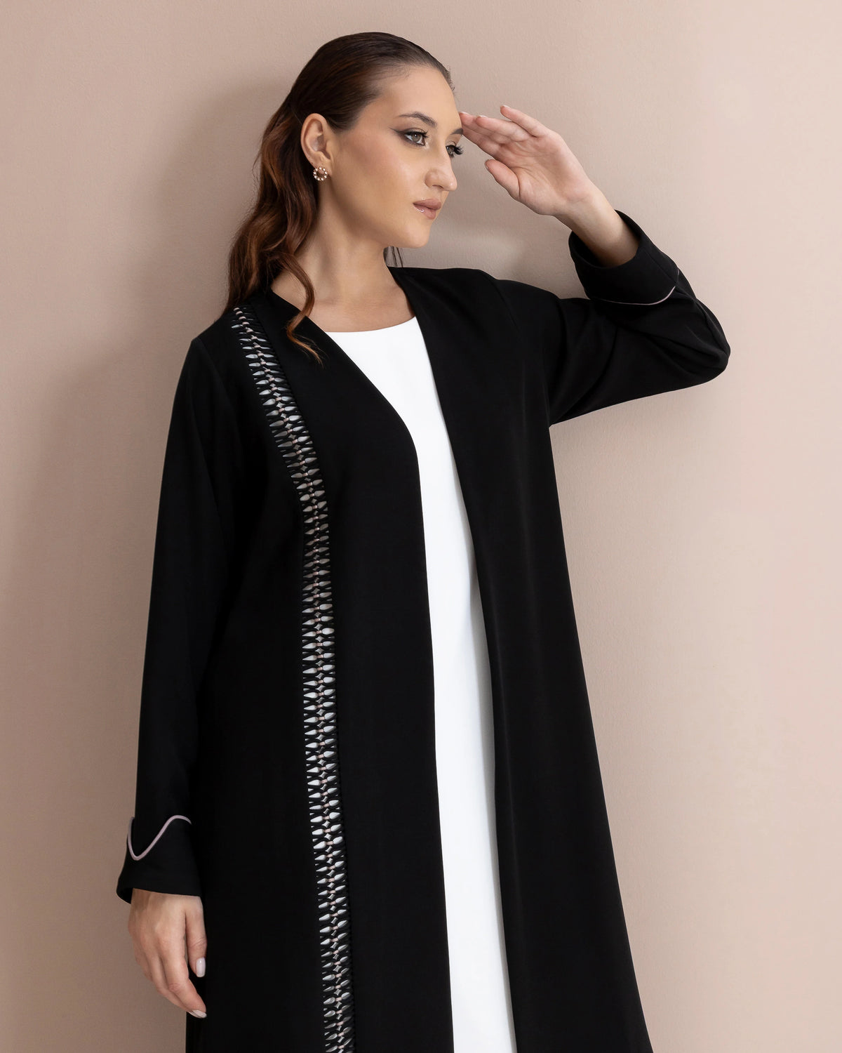 RASMAH Eclipse Noir portrait luxury abaya craftsmanship with monochrome woven panel