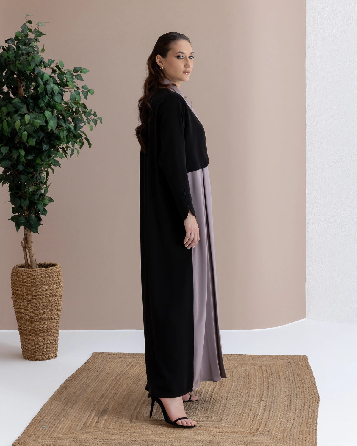 RAWAN Taupe Noir side-profile luxury abaya showcasing refined flowing silhouette