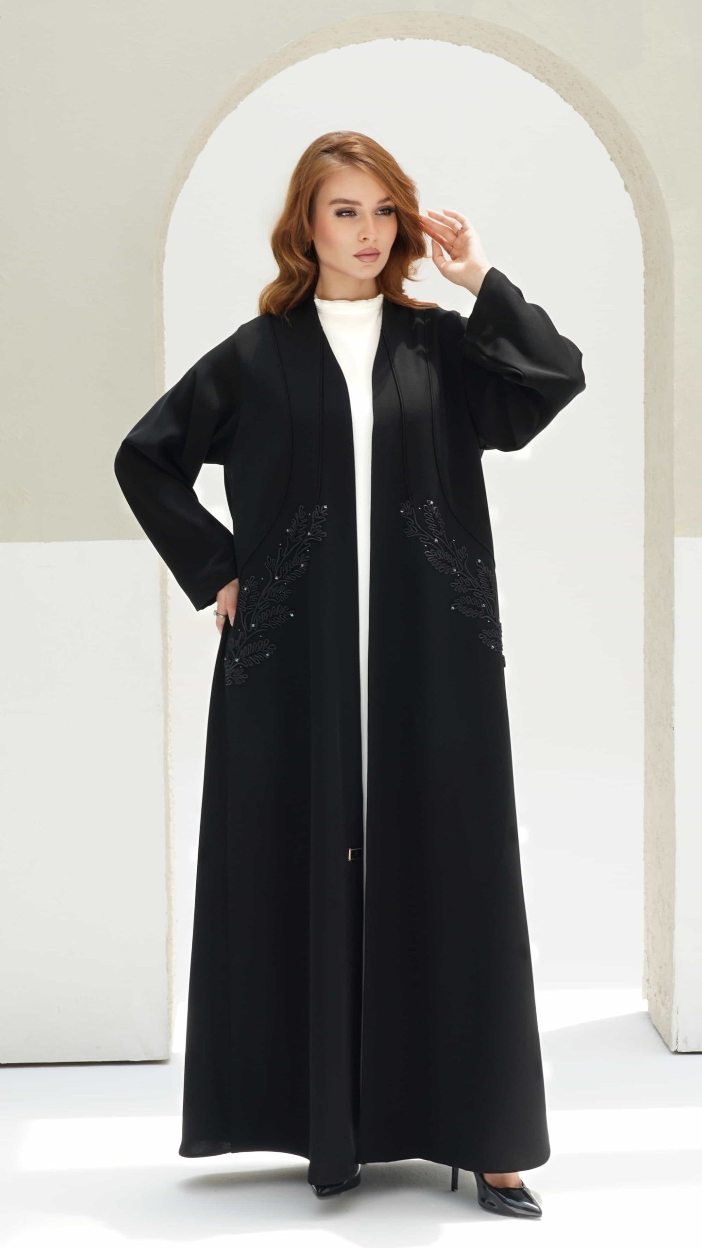 RAYHANA | Noir Botanique Full length black abaya with minimal leaf embroidery and refined open front design