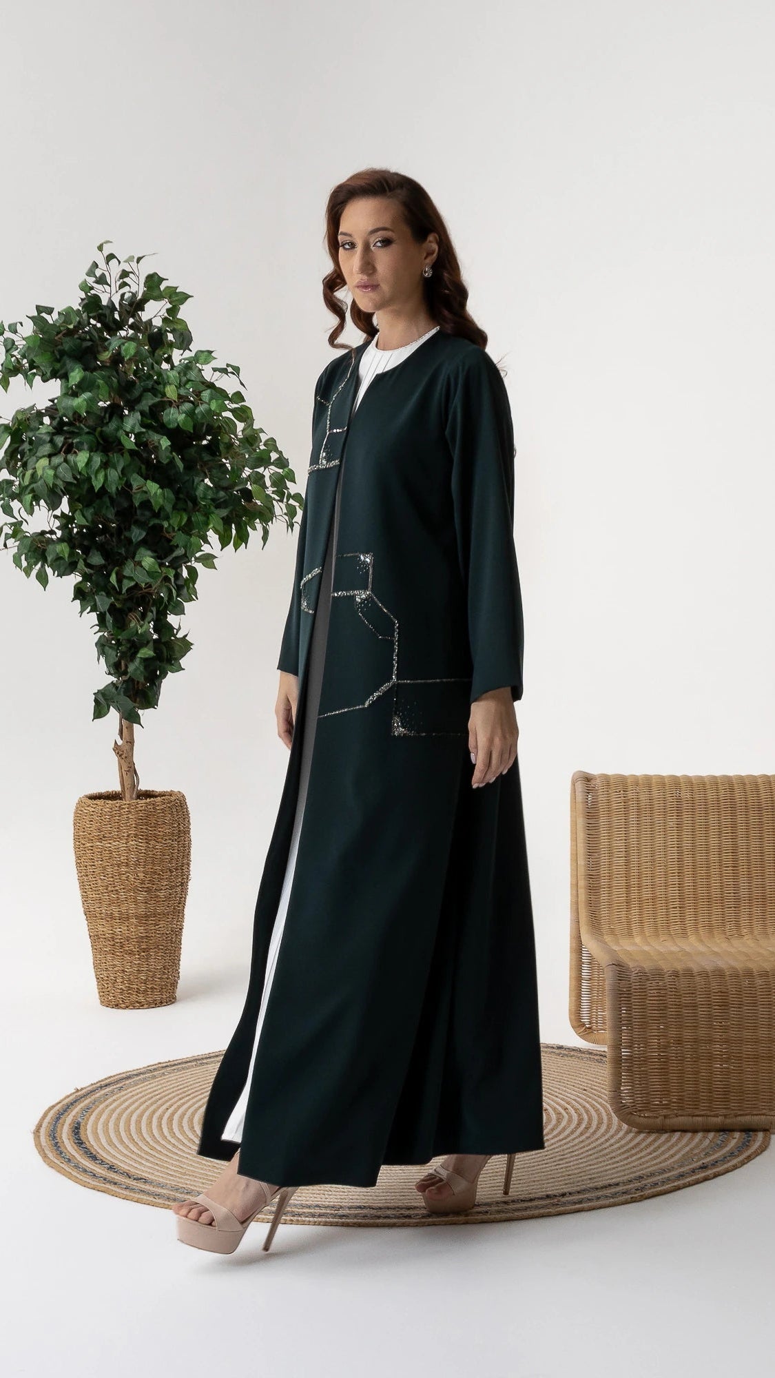 RUBA Emerald Mirage side profile of luxury emerald abaya with fluid drape and crystal accents