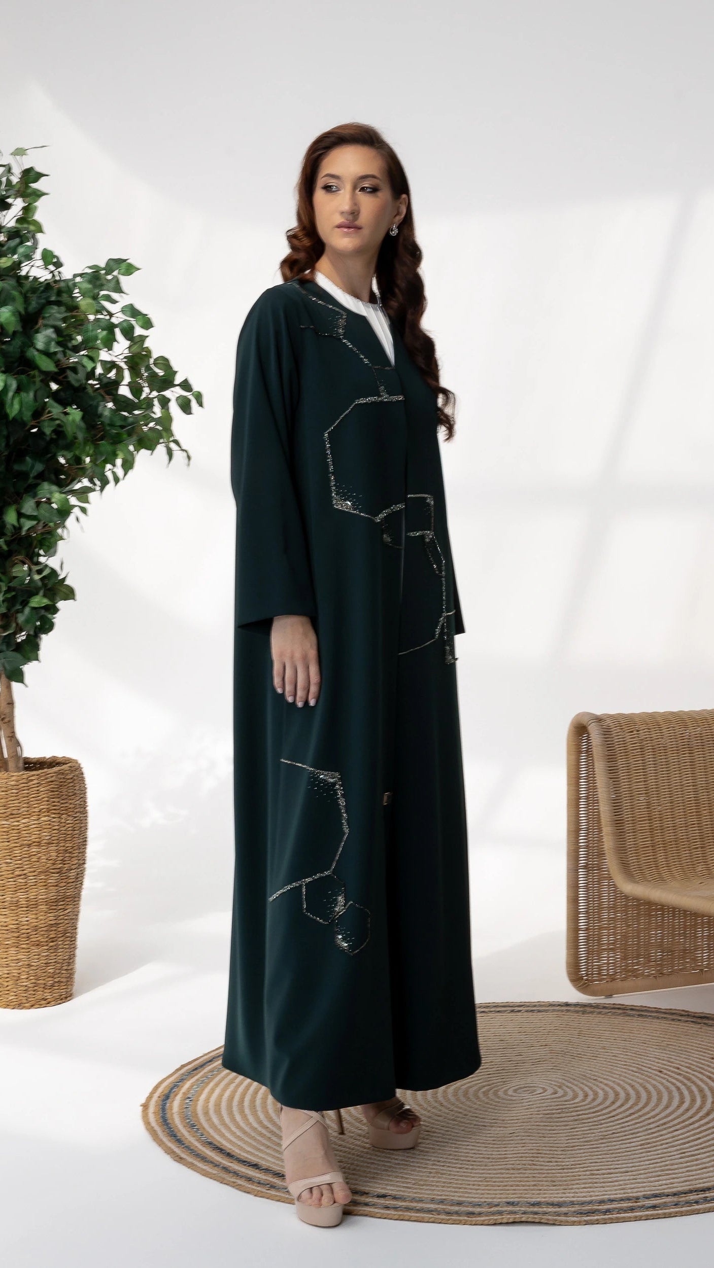 RUBA Emerald Mirage side profile of luxury emerald abaya with fluid drape and crystal accents