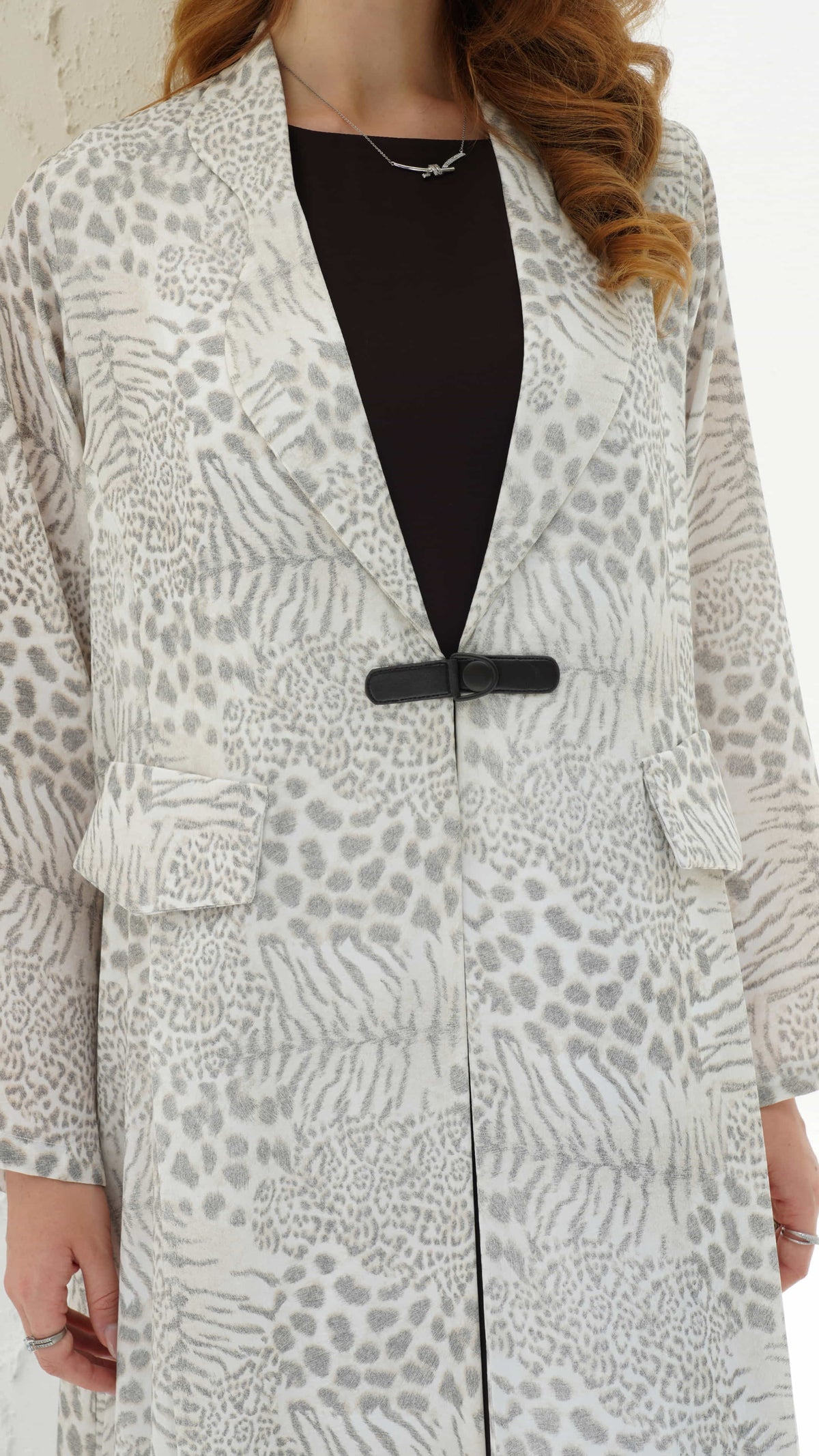 SAHARA | Desert Veil Close up of printed fabric texture on luxury abaya