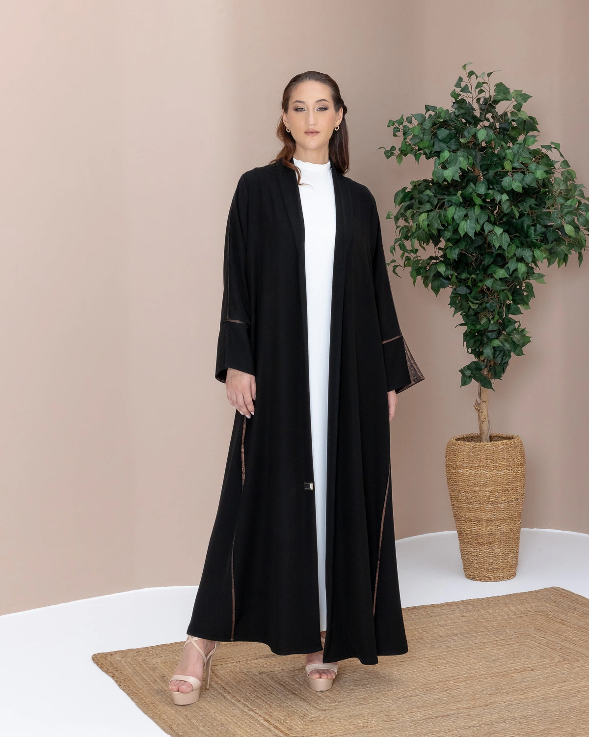 SAMRA Noir Bronze luxury black abaya with bronze trim full front editorial pose
