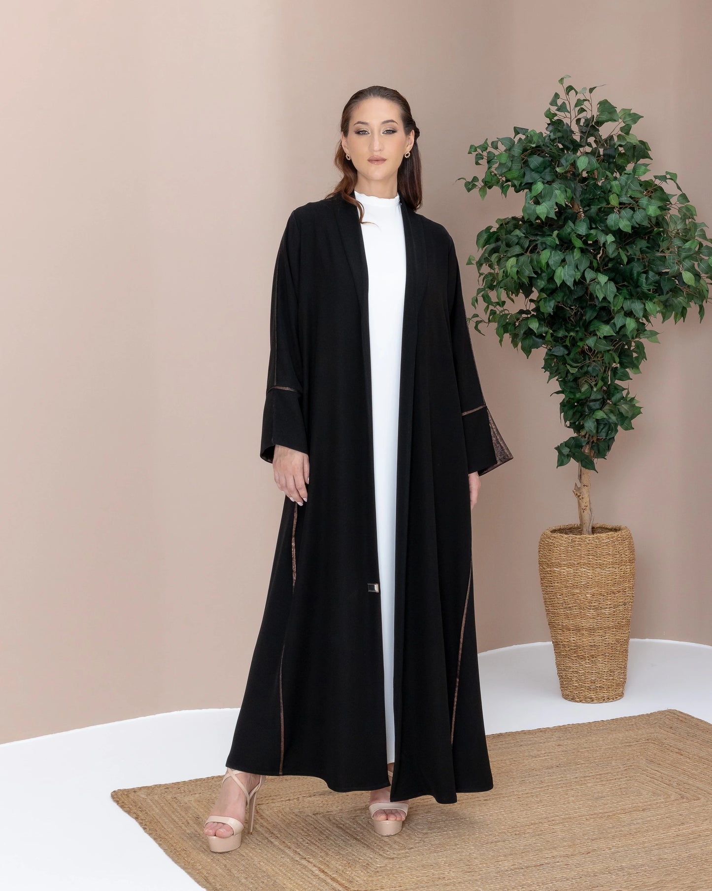 SAMRA Noir Bronze luxury black abaya with bronze trim full front editorial pose