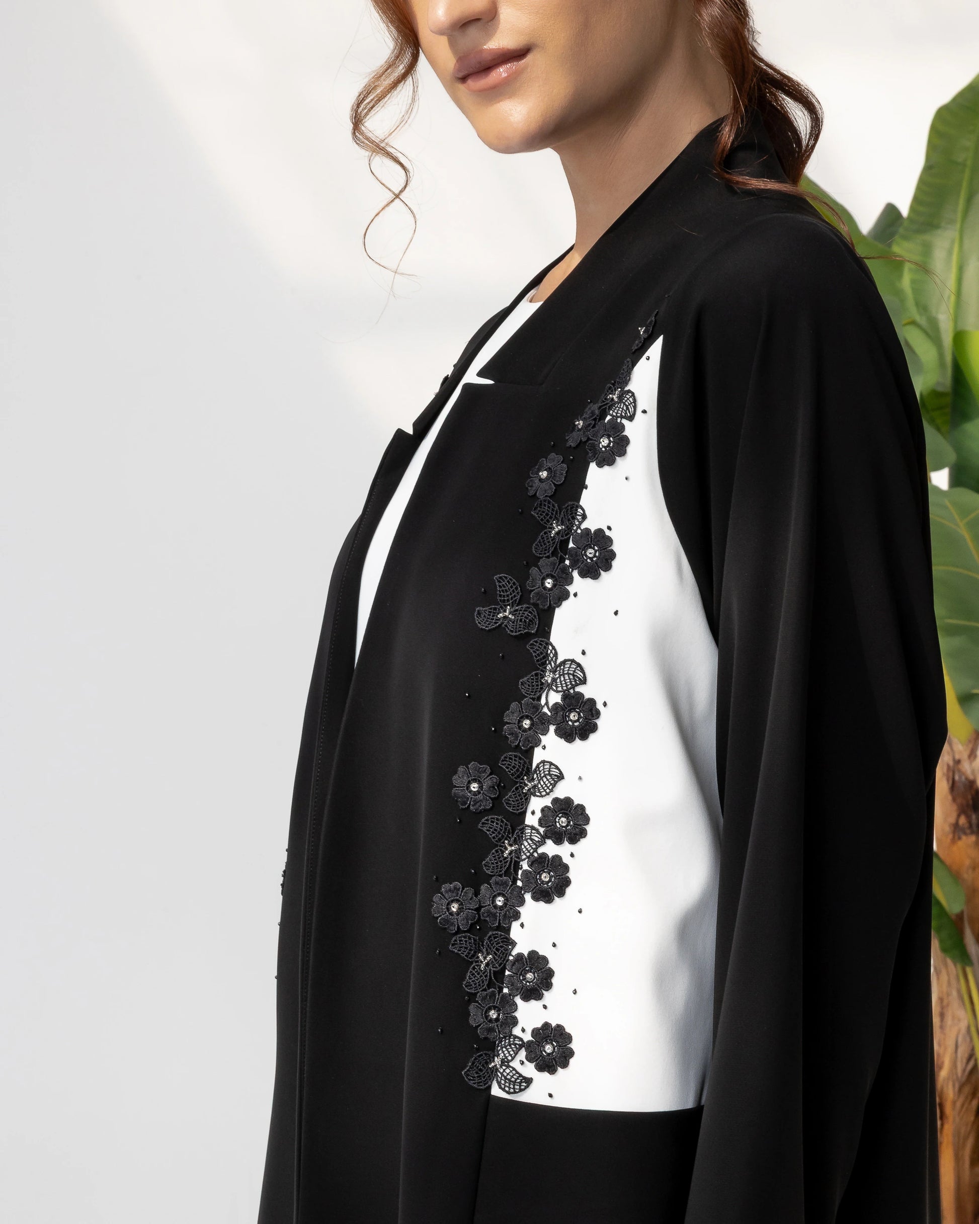 SARABAH Noir Mirage luxury black and white abaya with floral embroidery detailing close-up