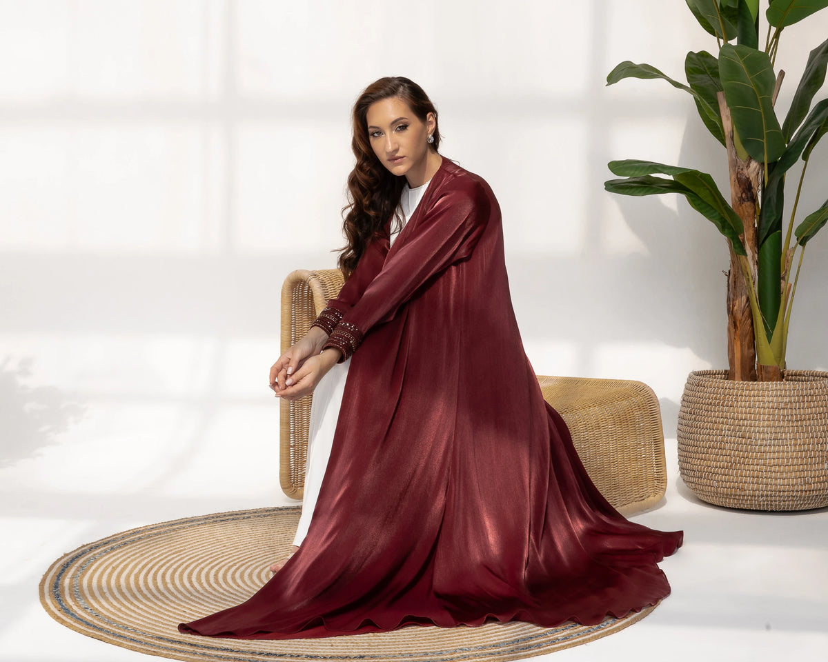 Selina | Ruby Éclat abaya side seated flow silhouette burgundy luxury abaya