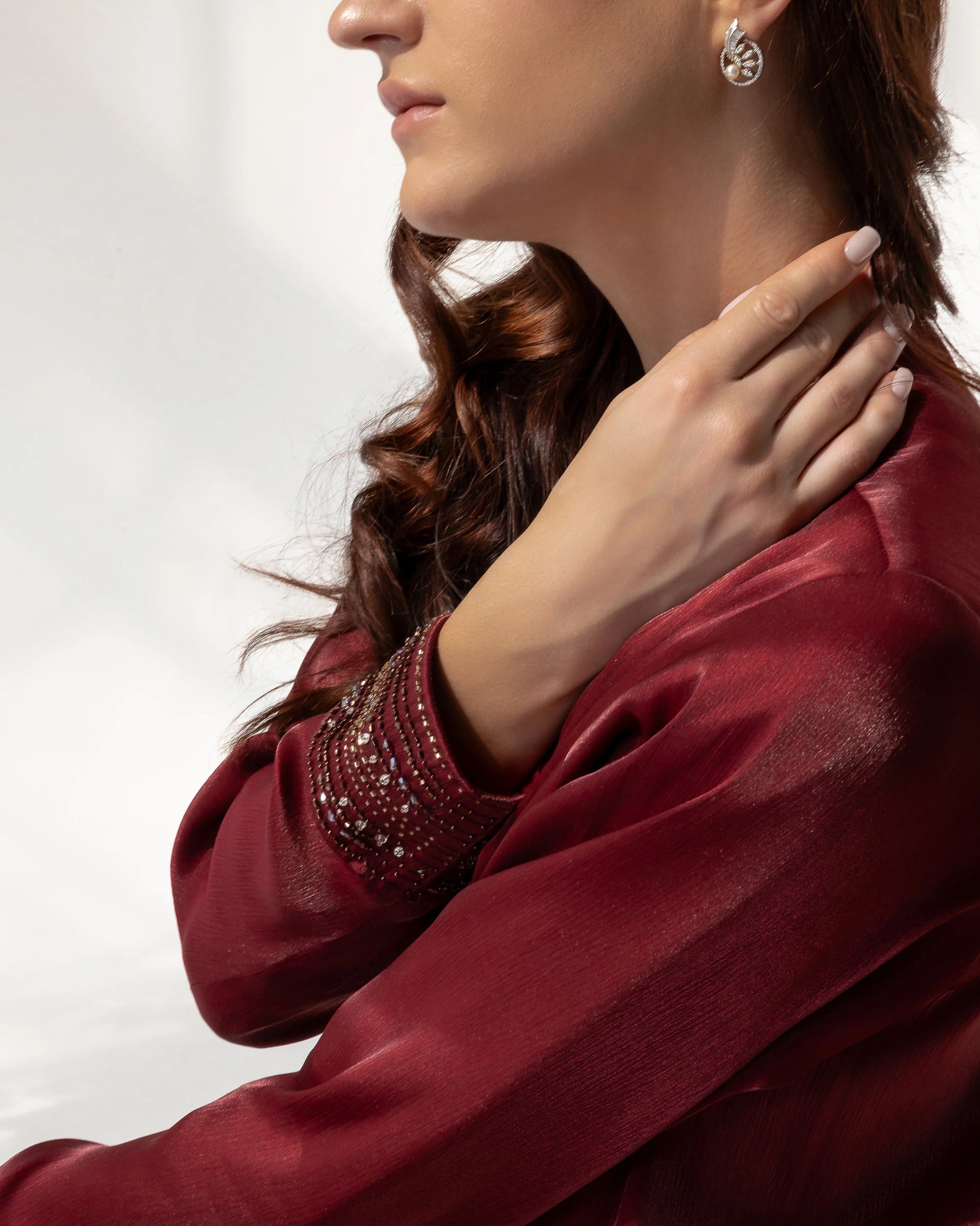 Selina | Ruby Éclat abaya model portrait soft sheen fabric detail