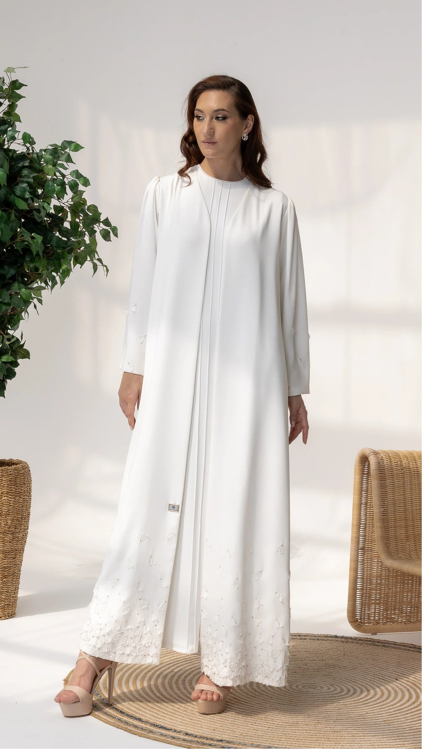 THALJIYYAH Snow-Blossom luxury ivory white abaya with hand-placed 3D floral petals full-length portrait