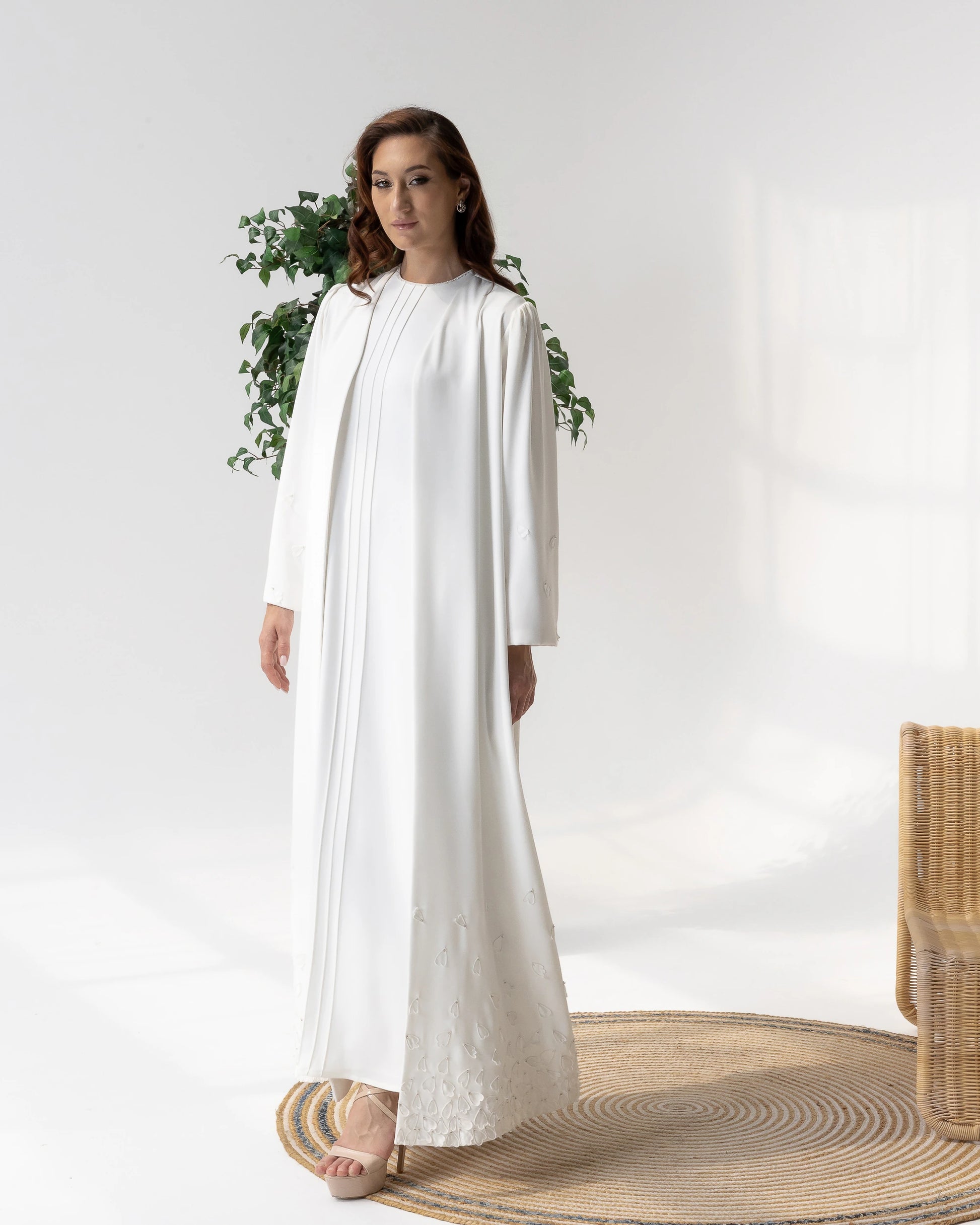THALJIYYAH Snow-Blossom elegant ivory abaya showcasing intricate floral couture craftsmanship