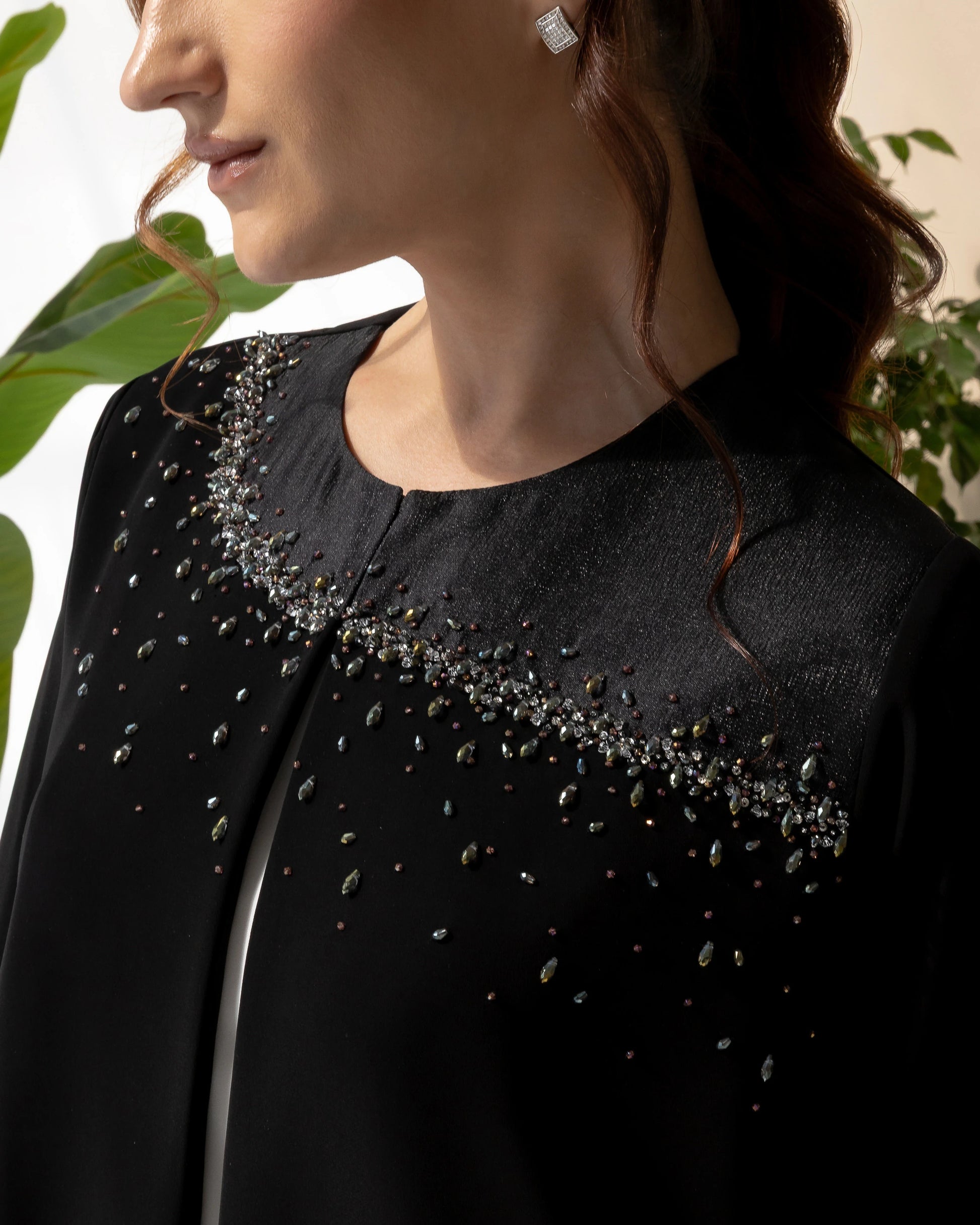 THURAYA Noir Celestia close-up of intricate celestial crystal embellishments on premium classic black