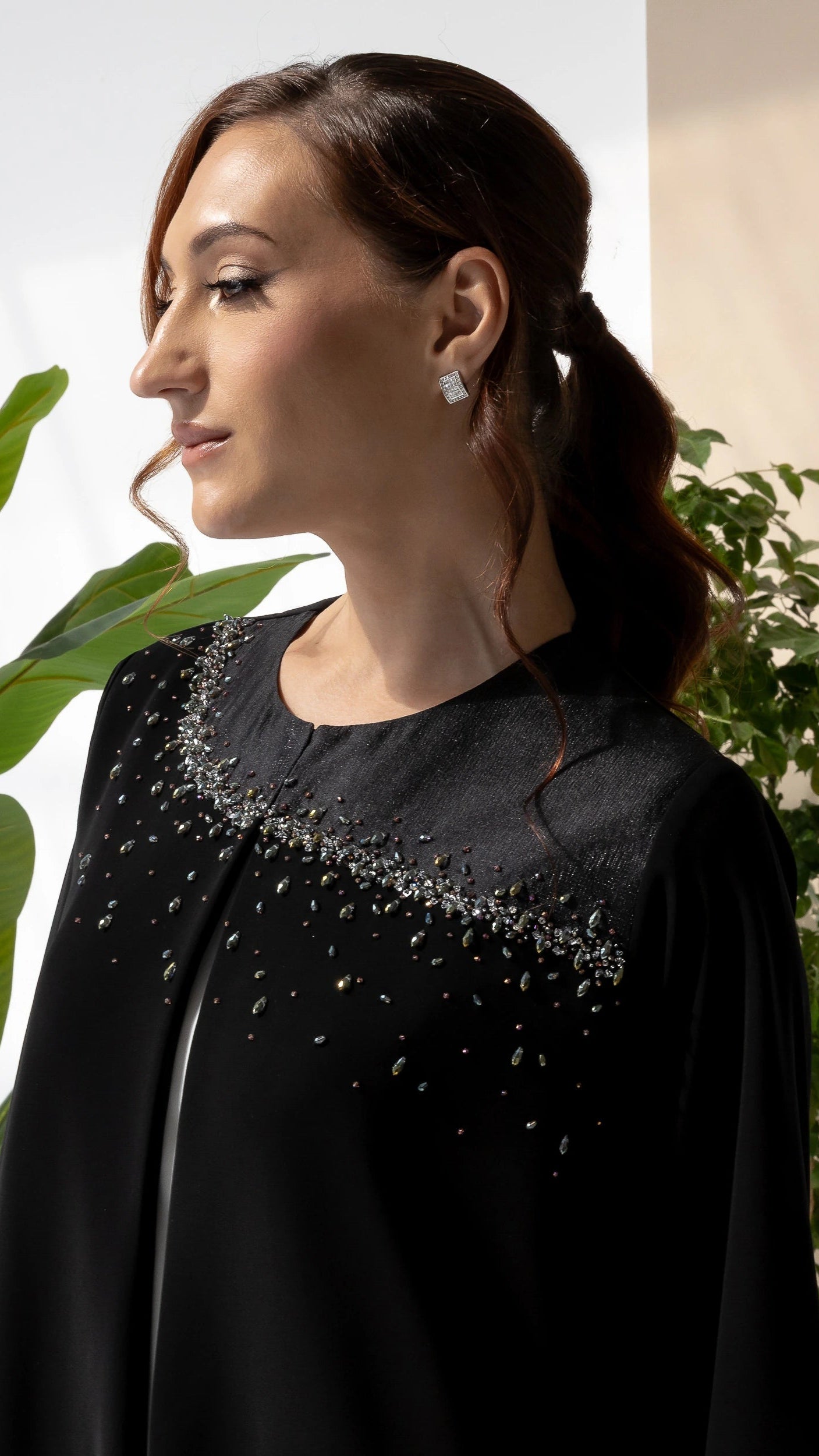THURAYA Noir Celestia couture black abaya featuring hand-embellished crystal neckline detailing