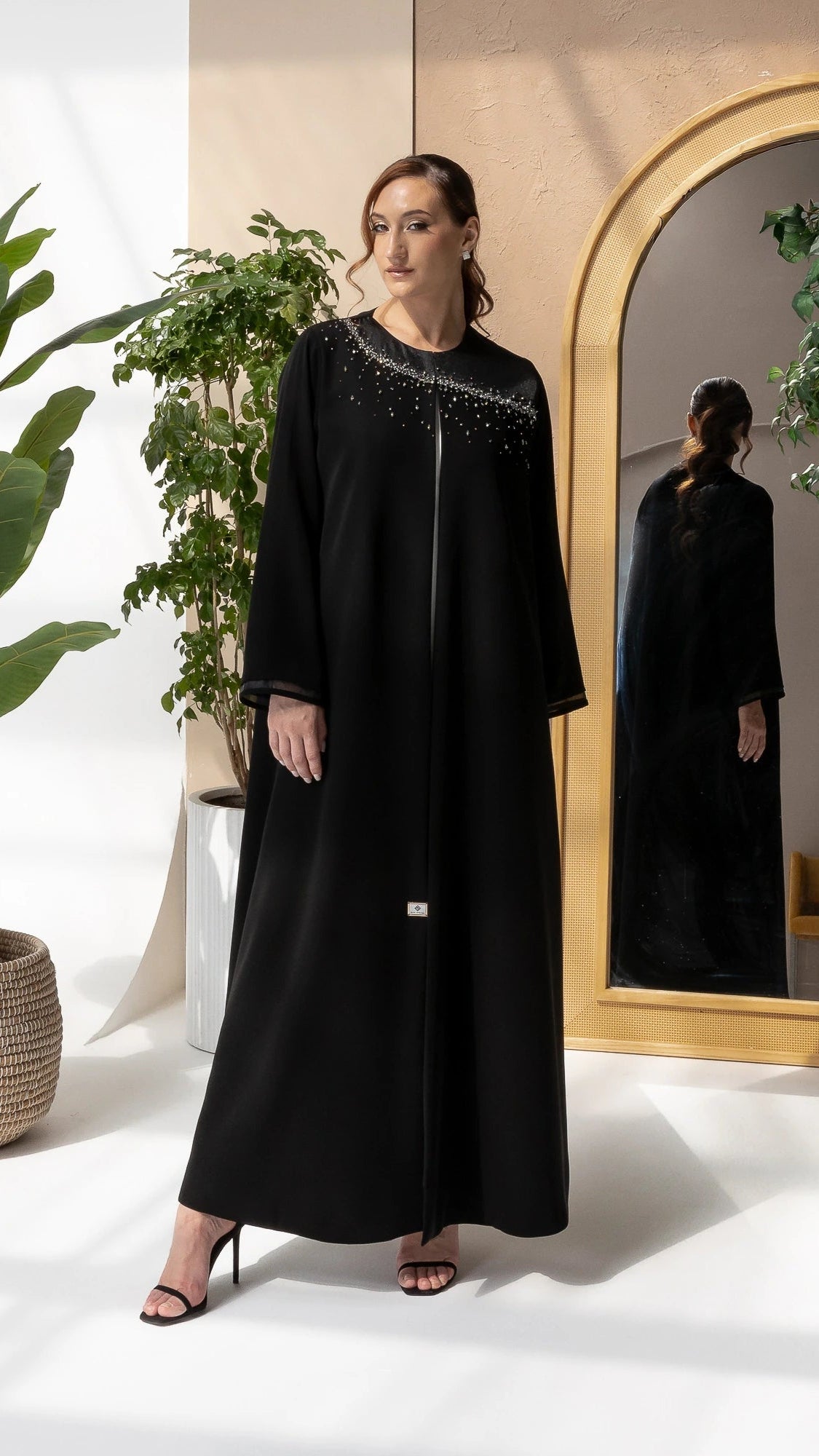 THURAYA Noir Celestia luxury black abaya with celestial gemstone embellishments full-length portrait