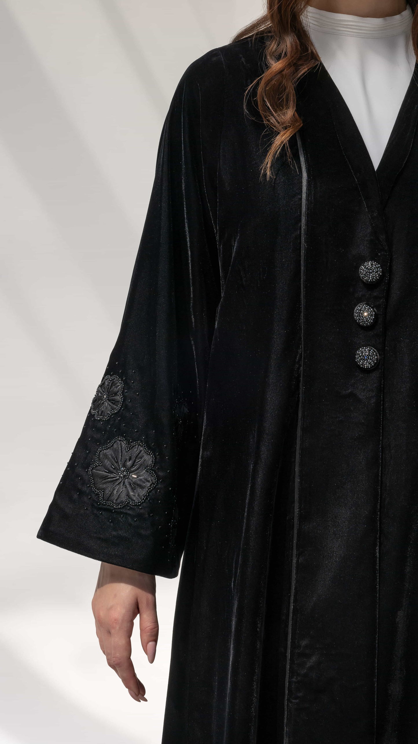Warda Noir Floral Velvet Abaya by Diva Atelier Side angle black velvet abaya showing floral beadwork sleeve design detail