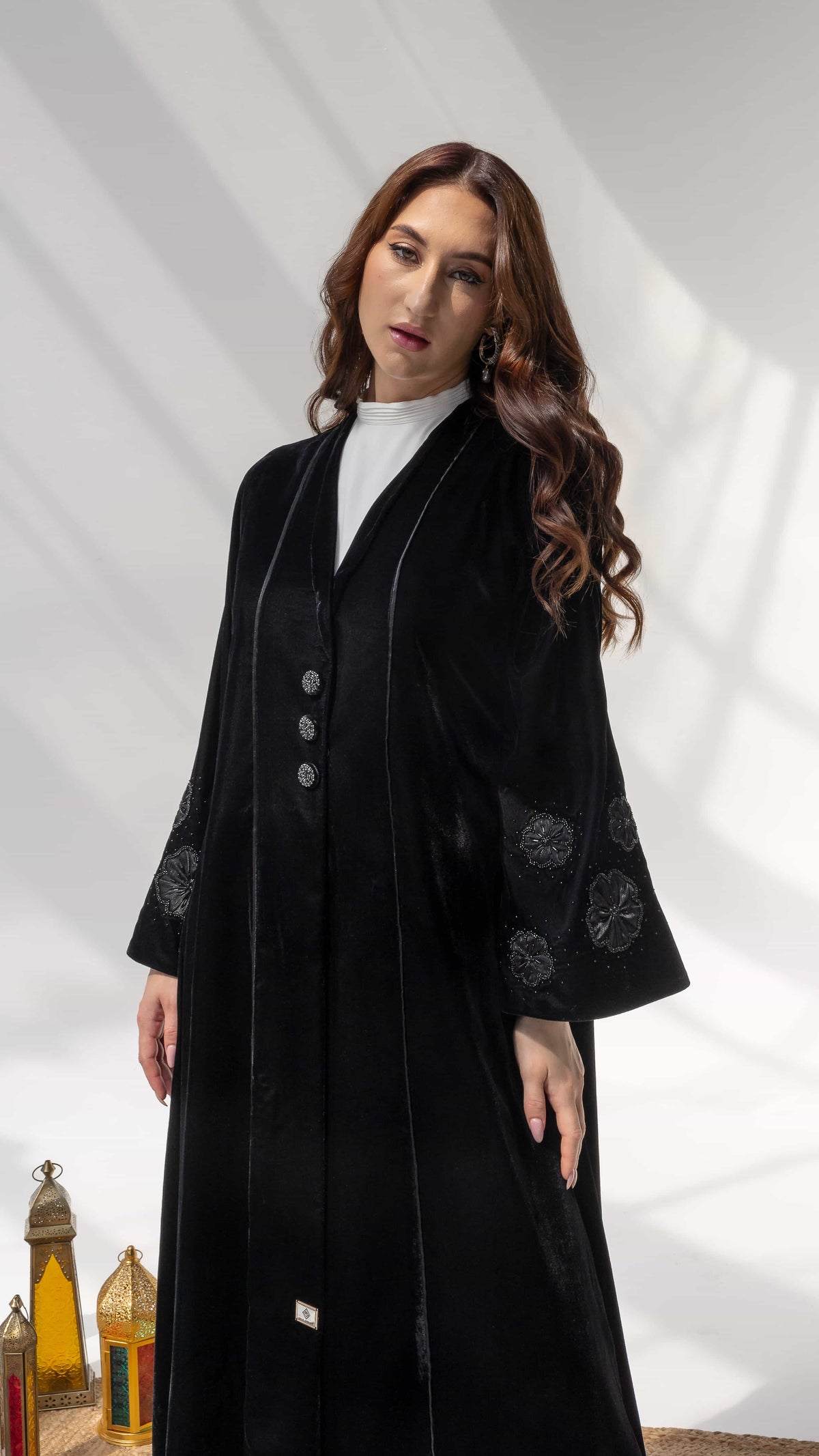 Warda Noir Floral Velvet Abaya by Diva Atelier - Front view black velvet abaya with structured lapel and statement buttons