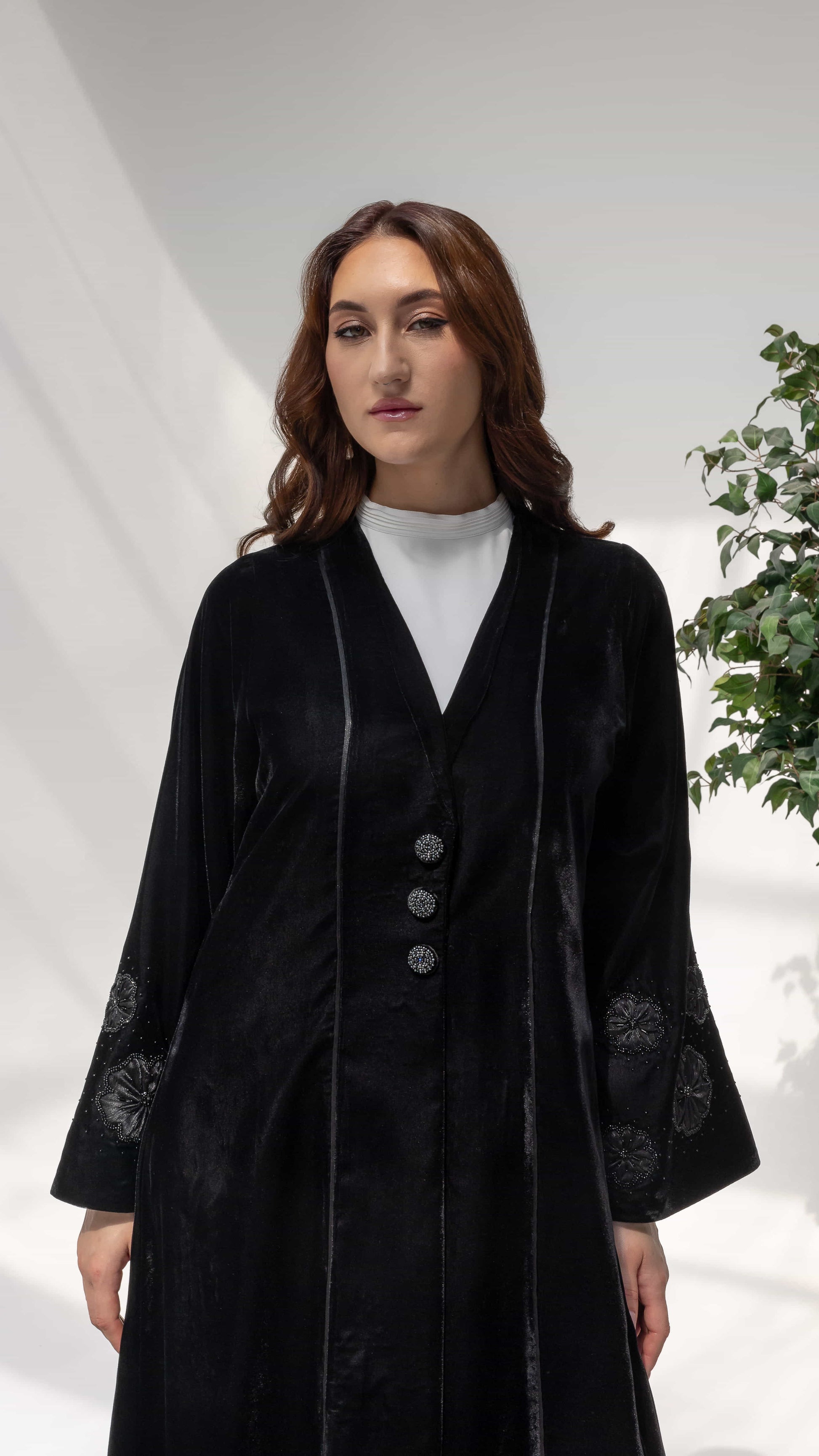 Warda Noir Floral Velvet Abaya by Diva Atelier portrait shot of black velvet abaya sleeve with intricate floral embroidery