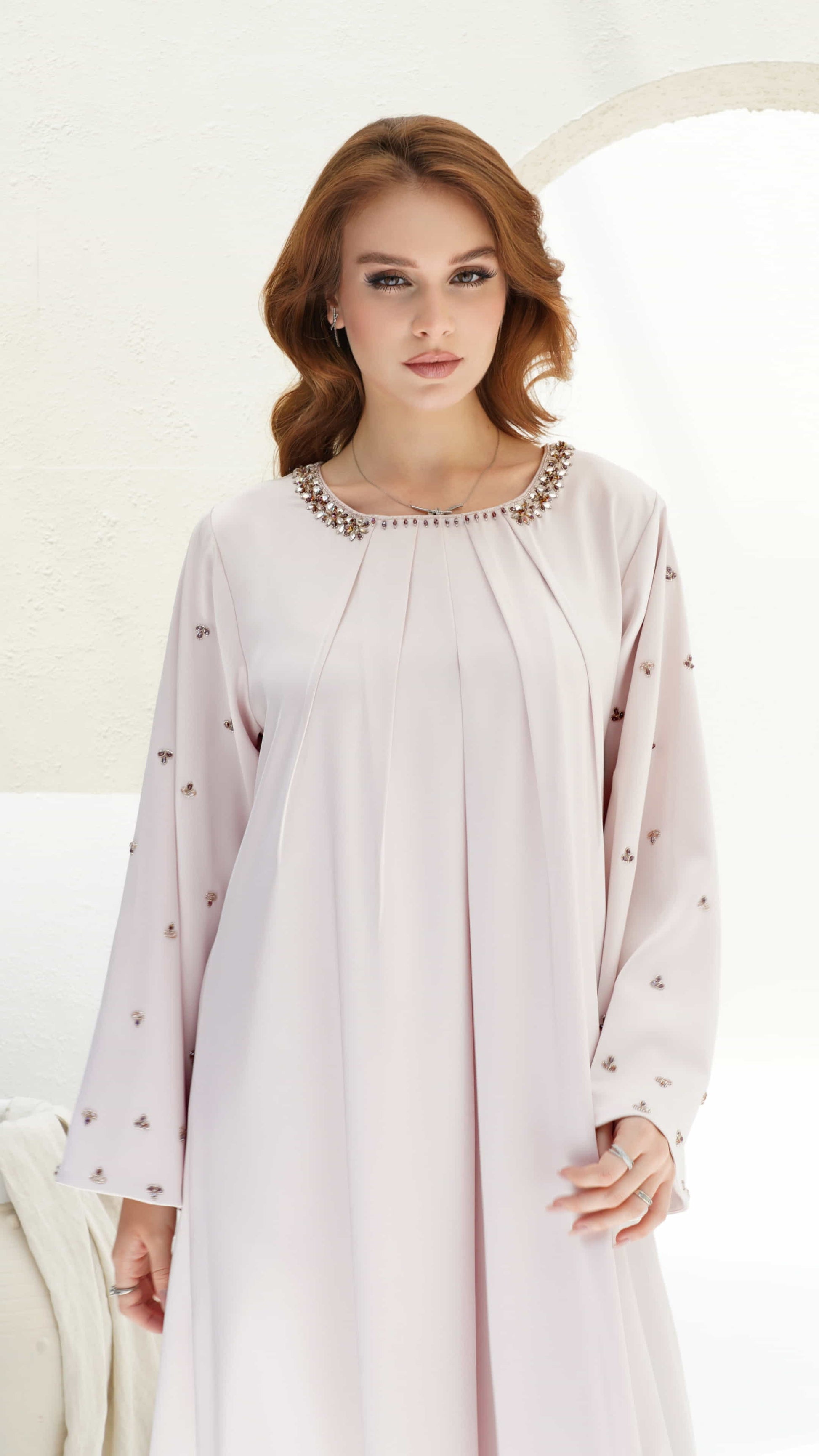 Zahira Blush Lumiere front pose of Zahira blush kaftan highlighting wide sleeves and delicate embellishments