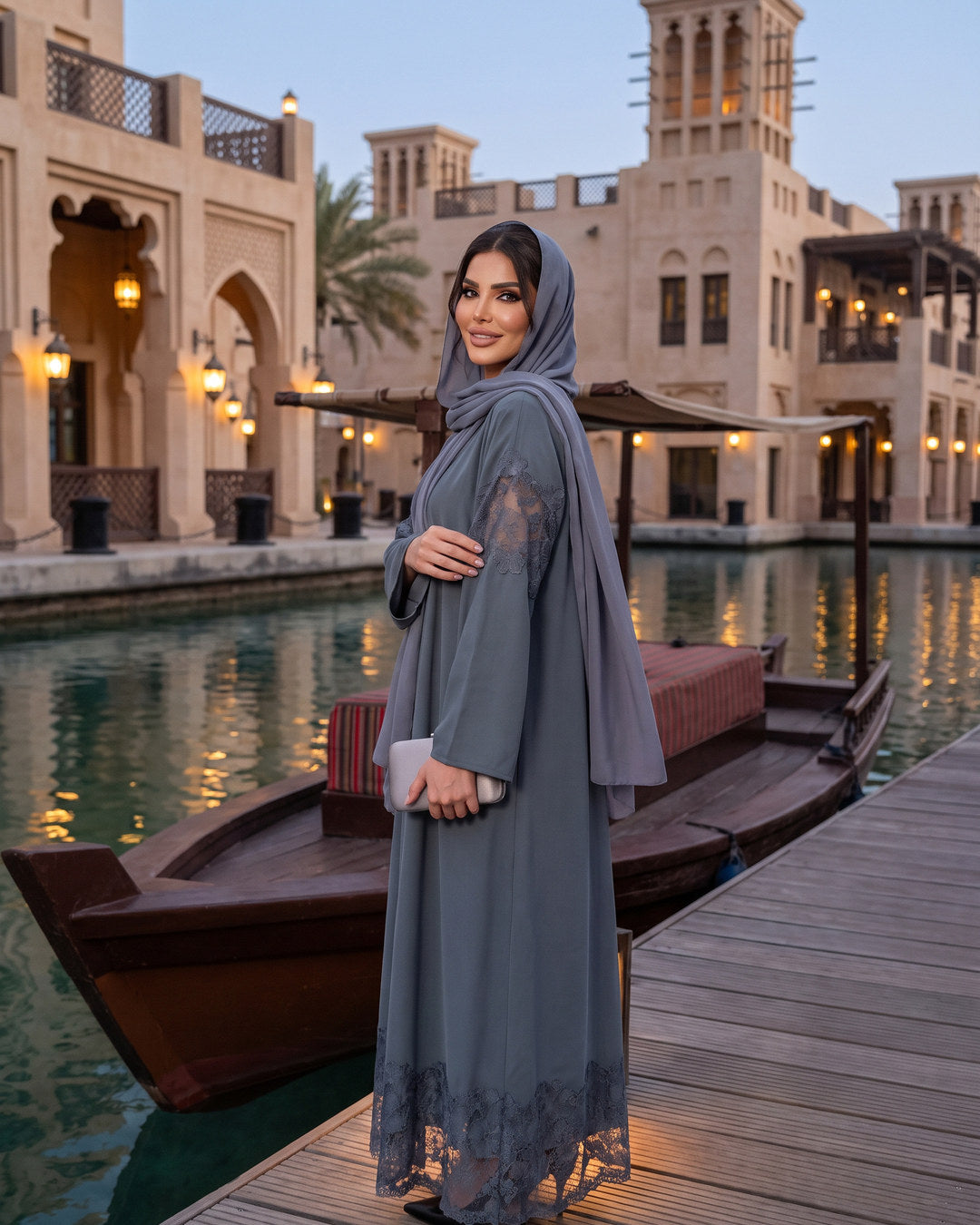SADEEM slate lace abaya by the souk waterfront at dusk, Dubai